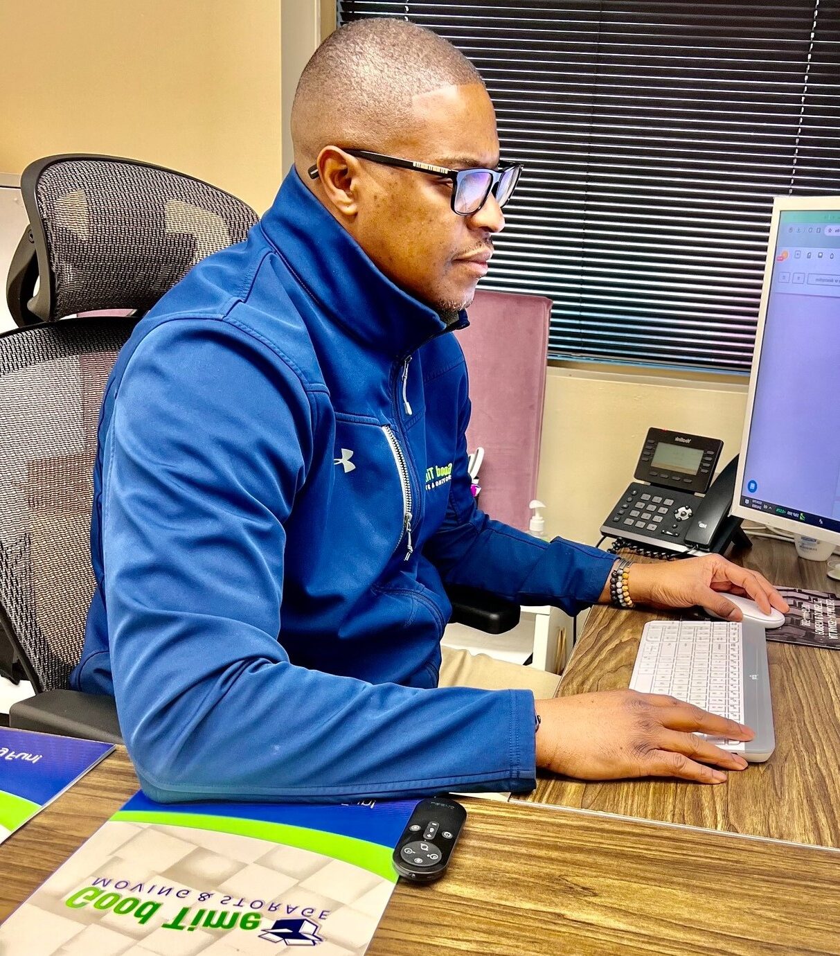Good Time Moving & Storage moving coordinator planning a customer move in the office